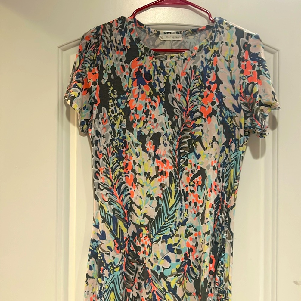Brand new. Never worn. Size small colorful dress.